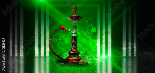 Hookah smoking on the background of an empty scene with a concrete floor  neon lights and smoke. Background trend color UFO green