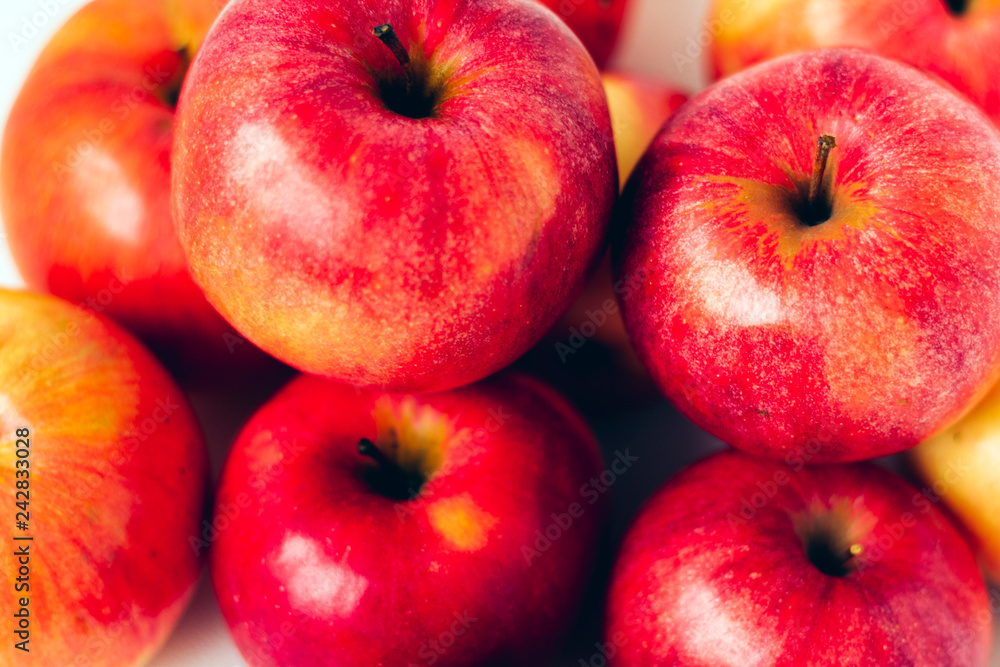 Fresh ripe red apples on white background, vegetarian concept. Fresh ripe red apples on white background, vegetarian concept.