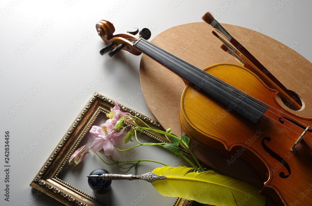 Fototapeta premium Violin, palette, brush, feather and inkwell.
