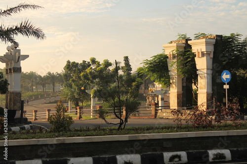 gumul building with palm tree at morning in Kediri, Indonesia photo