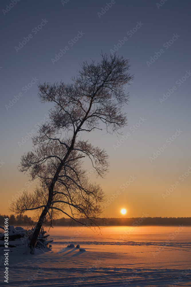 Sunset on a frozen lake. Winter landscape. Sunset on a frozen lake. Winter landscape.