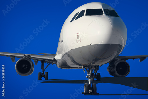 Commercial air plane on a blue background .
