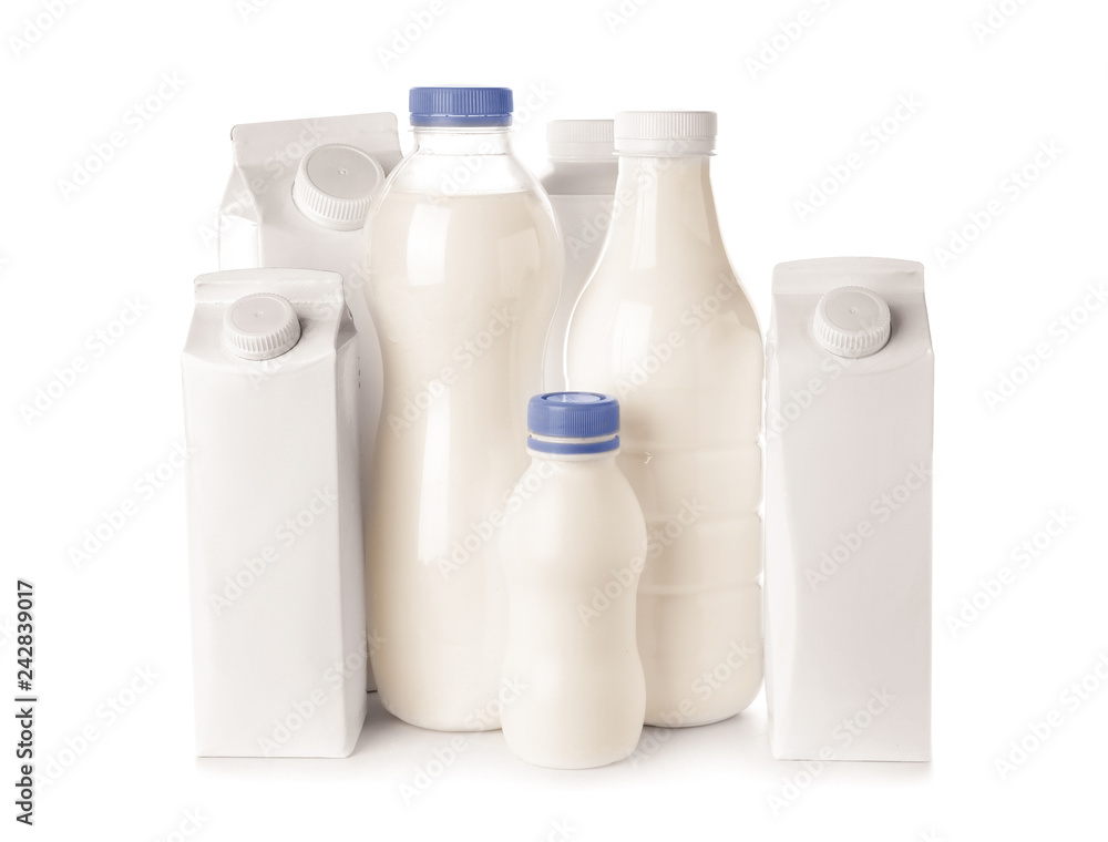 Different packs with milk on white background