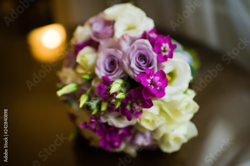 wedding bouquet of the bride  white and purple roses