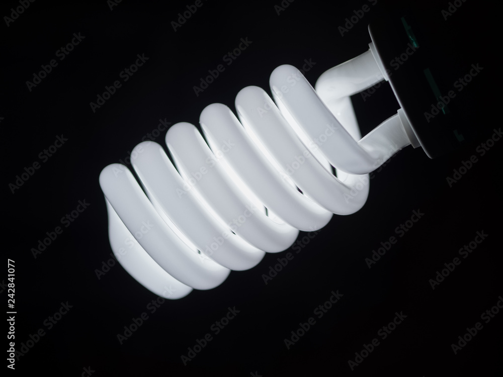 Energy Saving lamp on dark background. Energy Saving lamp on dark background.
