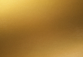 golden shiny gradient background. golden paper with metallic effect.