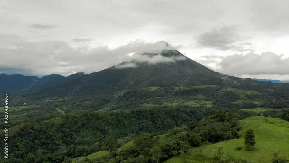 Aerial: Low Clouds Around Lush Green Arenal Volcano Mountain Aerial: Low Clouds Around Lush Green Arenal Volcano Mountain