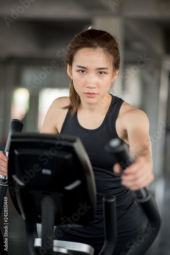 Asian woman on treadmill in the gym