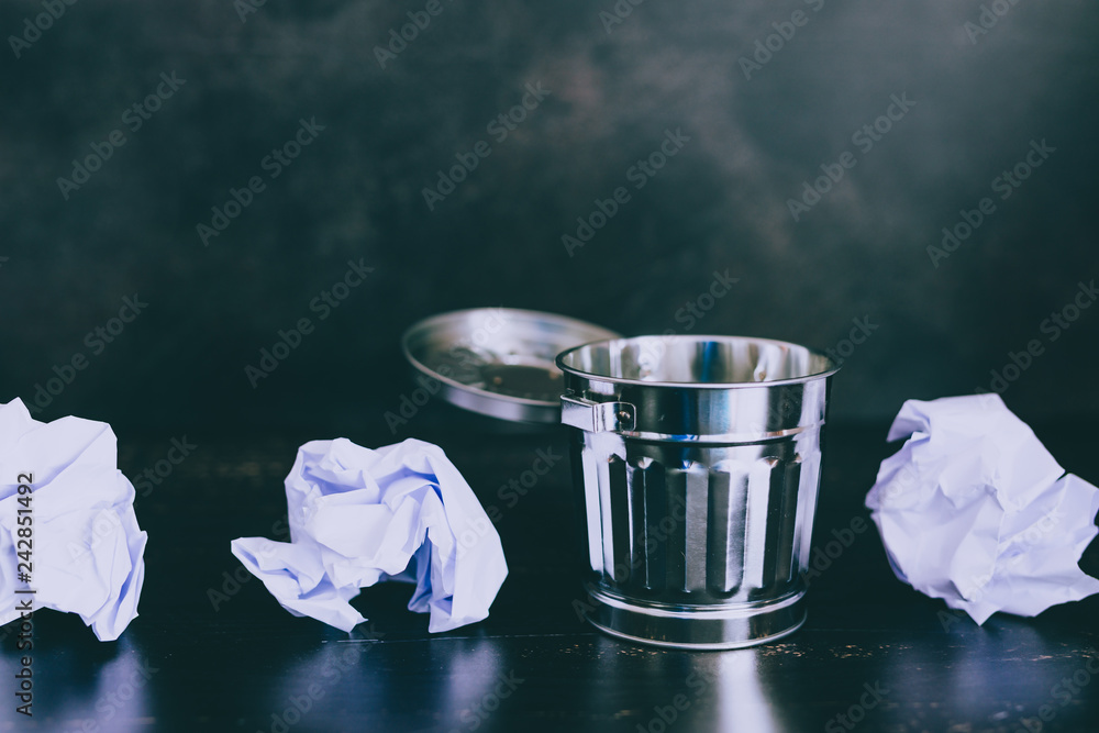 miniature garbage bin with paper balls to be thrown away miniature garbage bin with paper balls to be thrown away