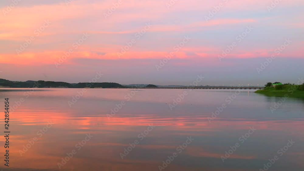 Lake and city silhouette at sunset. Calm scene at the sunset Lake and city silhouette at sunset. Calm scene at the sunset