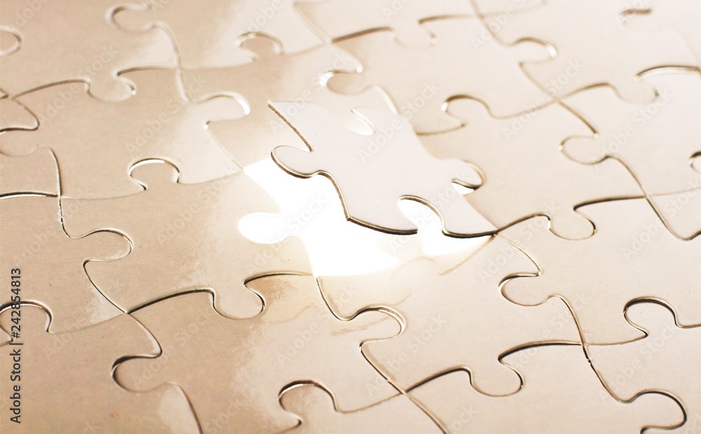 Fitting last white puzzle piece. Concept image of building and Fitting last white puzzle piece. Concept image of building and