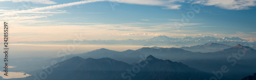 Panoramic view of the Italian Alps with fog on the Padana plain  Monte Rosa in the background. Viewpoint from the summit of Monte Resegone  Lombardy. Italian Landscape.