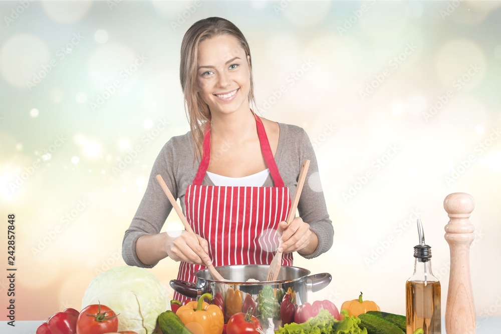 Young beautiful woman Cooking in kitchen Young beautiful woman Cooking in kitchen