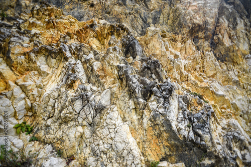 Texture of limestone rock in different colors.