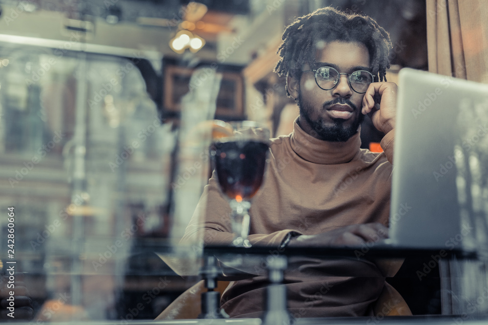 Hard-working stylish man being deep in thoughts