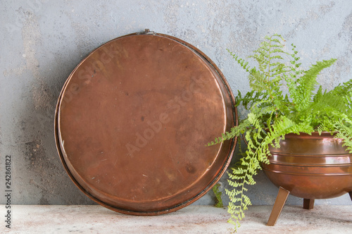 Vintage copper mold on a concrete background.