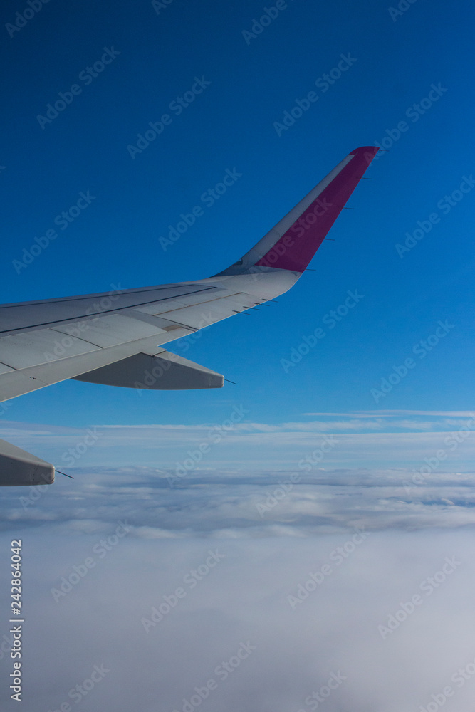 The wing of the plane in the clouds The wing of the plane in the clouds