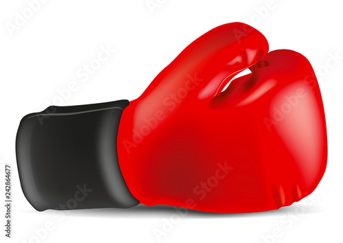 Un gant de boxe rouge posé dur un fond blanc pour symboliser le combat et la victoire sur l’adversaire photo