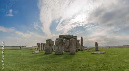 stonehenge in england on sunny day with light cloud