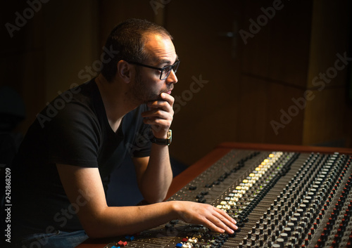Wallpaper Mural Guy in the studio mixing music on the analog console. Torontodigital.ca