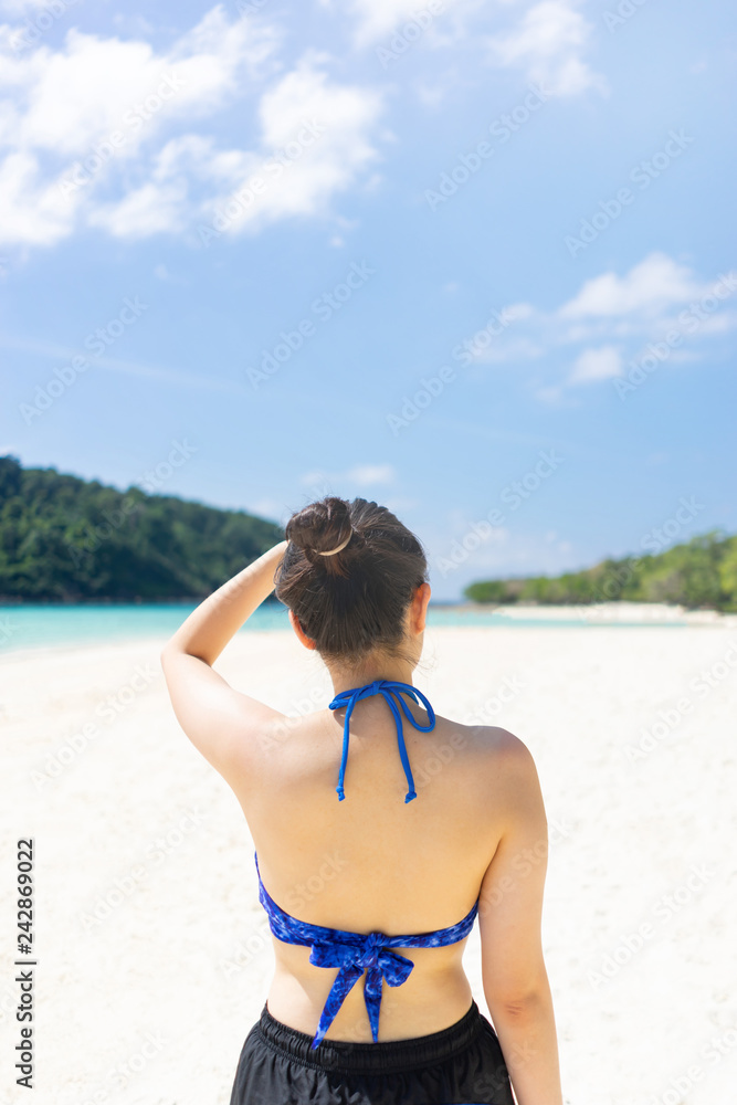 Young traveler girl at the beach in Phuket, Thailand.