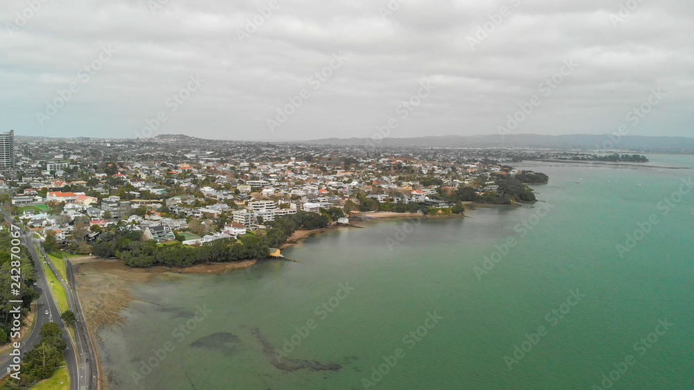 Aerial view of Auckland on a cloudy day, skyline and port, New Zealand