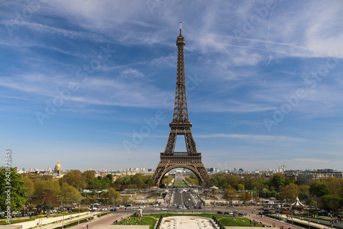 Eiffel Tower and there are a lot of tourists, cars and trees near it © kazanovskyiphoto