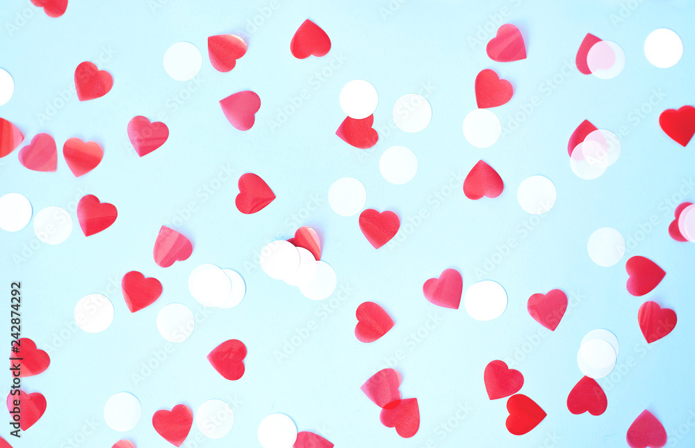 Valentine's day background on a blue background with hearts.
