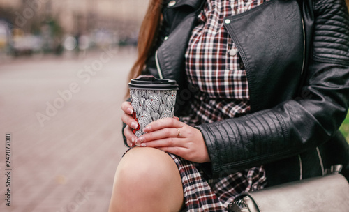 woman holding coffee, closeup