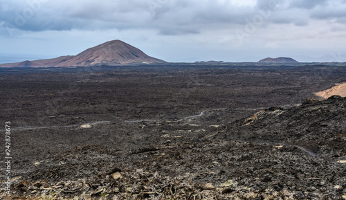 Volcanoes on the horizon in Timanfaya National Park, Lanzarote, Spain