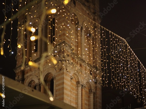 Ferrara, Italy. Bell tower in the night. Christmas time.