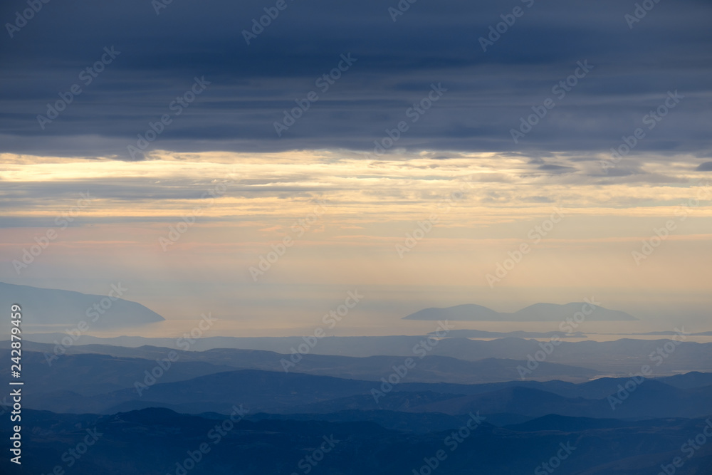 Evening view from Mount Tomorr, Albania, over misty mountain range