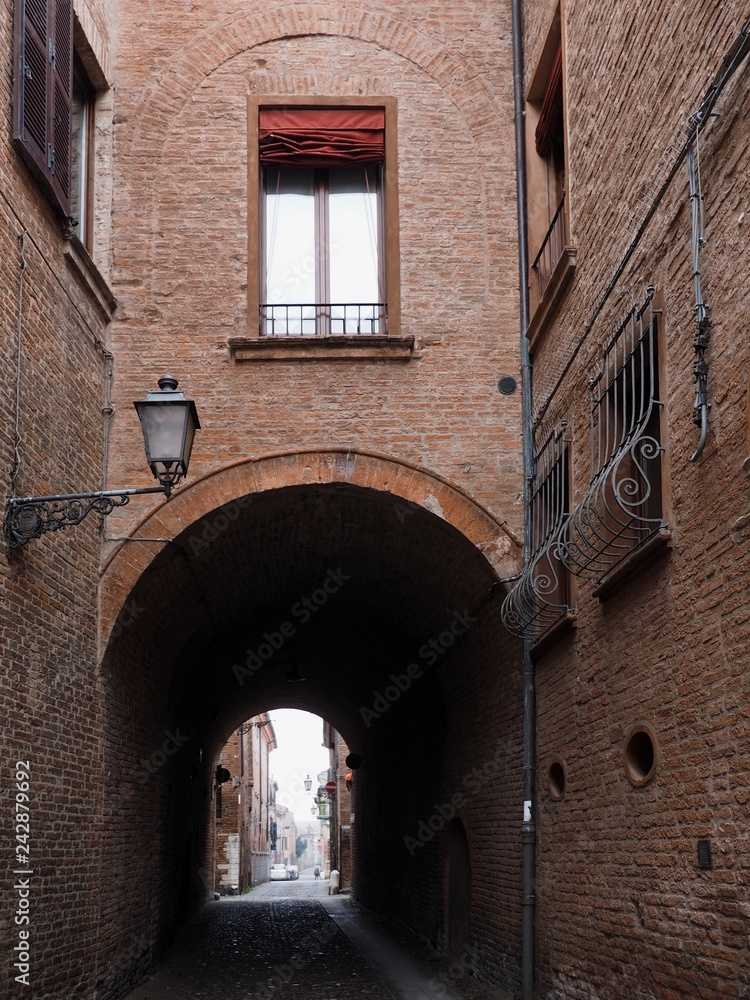 Ferrara, Italy. Downtown, archway.
