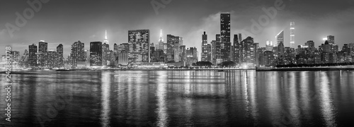 Black and white New York City panorama at night, USA.