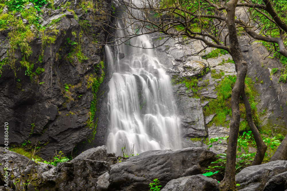 Obraz premium Khlong Lan Waterfall, the beautiful waterfall in deep forest at Khlong Lan National Park ,Kamphaeng Phet, Thailand,