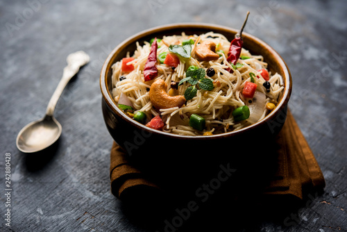 Spicy semiya uppma or upma served in plate. selective focus photo