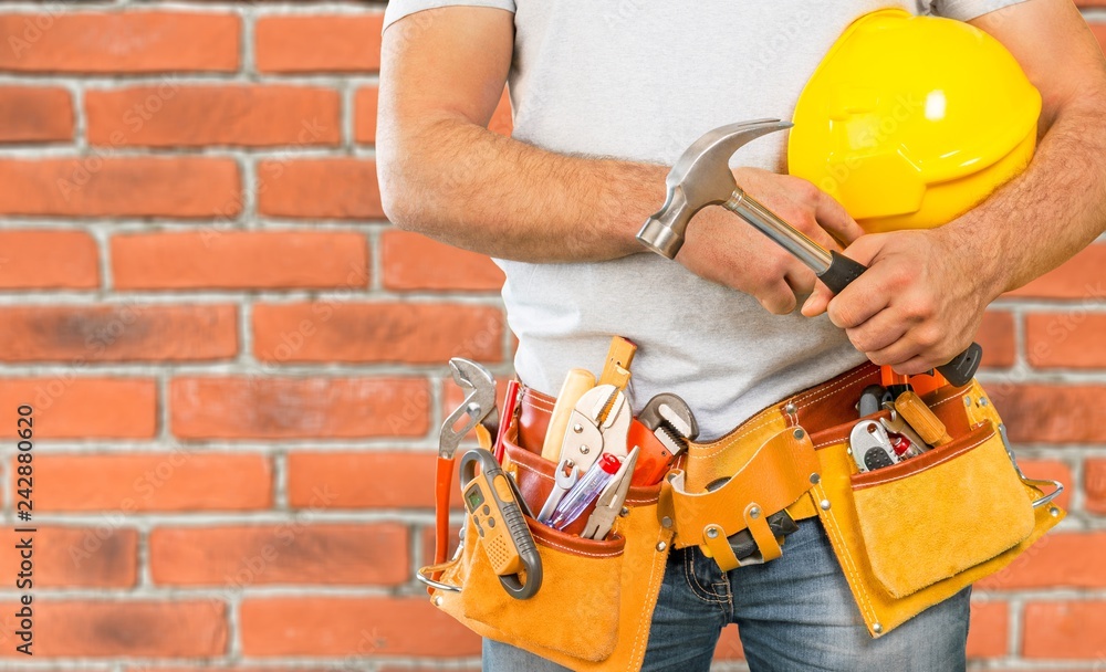 Worker with a tool belt. Isolated over background. Worker with a tool belt. Isolated over background.