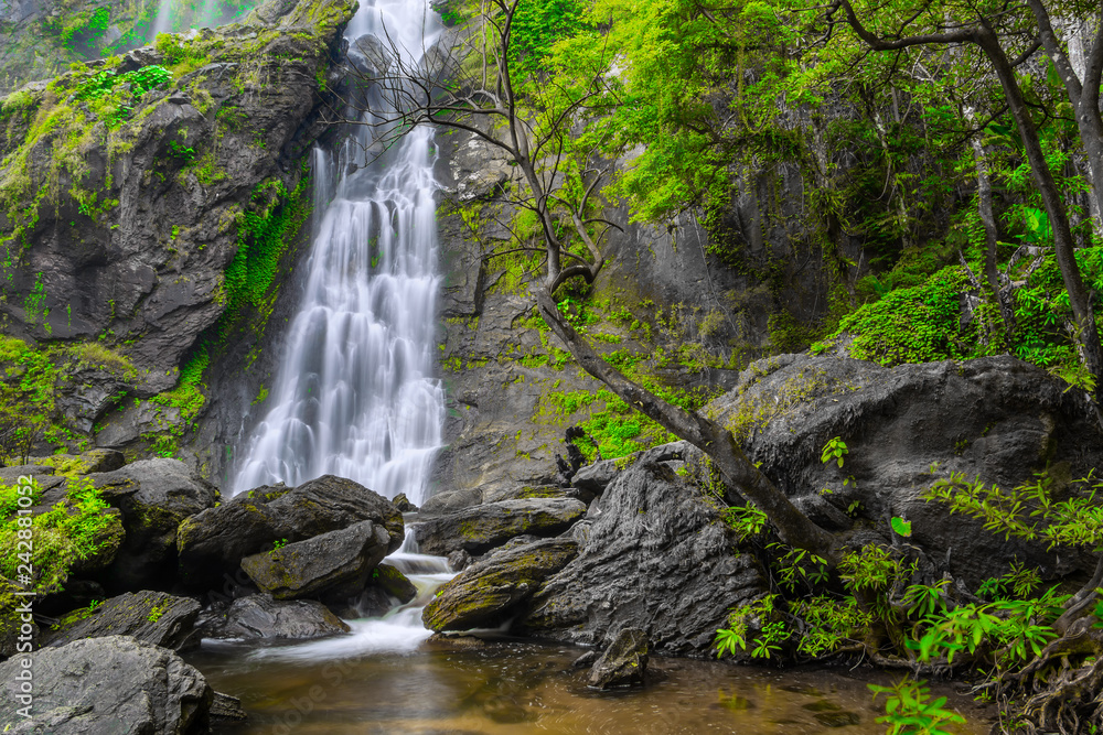 Khlong Lan Waterfall, the beautiful waterfall in deep forest at Khlong Lan National Park ,Kamphaeng Phet, Thailand Khlong Lan Waterfall, the beautiful waterfall in deep forest at Khlong Lan National Park ,Kamphaeng Phet, Thailand