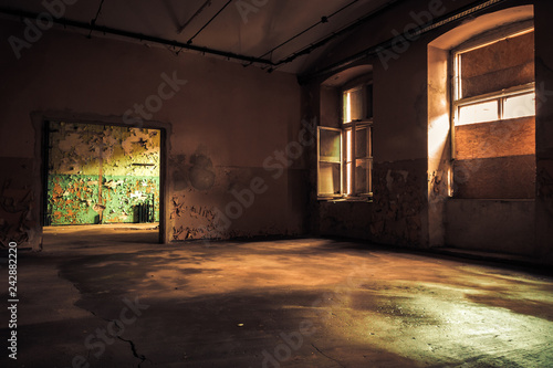 Dark interior inside abandoned old factory building 
