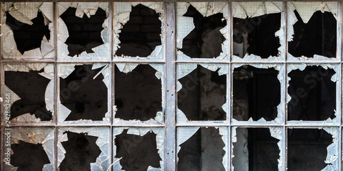 Broken glass in iron frame window