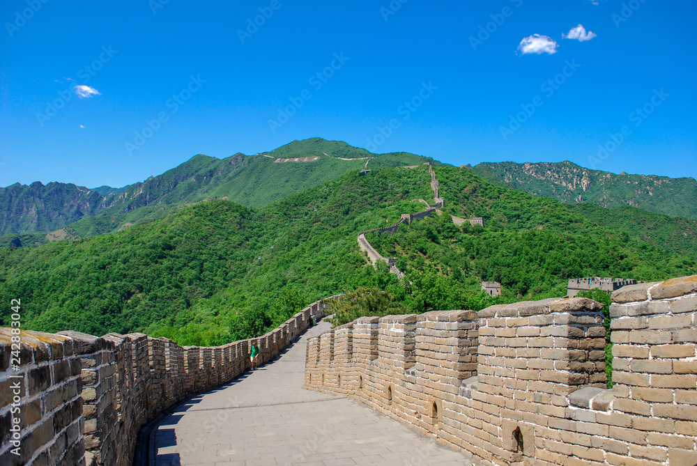 The walkway atop the Great Wall of China stretching across the mountains