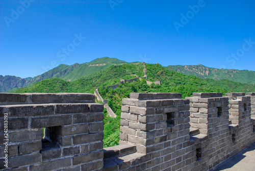 Stone parapet wall atop the Great Wall of China in the mountains