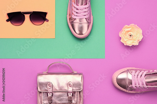 Fashion minimal flat lay. Stylish shoes, trendy handbag, sunglasses. Bright hipster urban style. Woman fashionable accessories design set. Top view