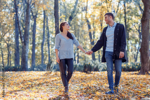 Natural photos of a happy couple in love having fun outside on a sunny autumn day. Togetherness and happiness concept