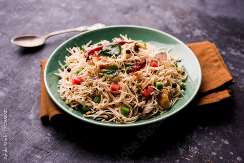 Semiya Upma or Vermicelli Uppuma or uppittu is a popular breakfast menu from south India. served in a bowl. selective focus photo