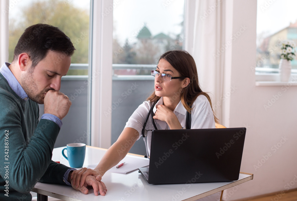 Doctor and patient talking at table Doctor and patient talking at table