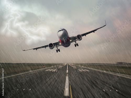 Lightning strike on an airplane in bad weather raining thunderstorm during  landing at the airport runway. Pilots unable to make a successful landing and making a go around. Dangerous hazard concept.