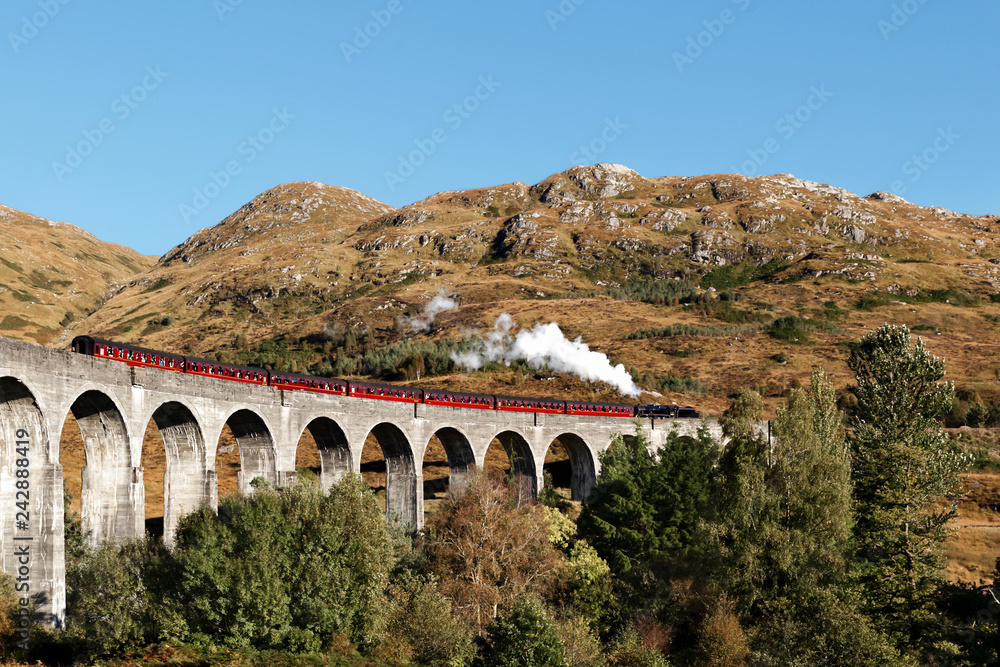 Glenfinnan Viaduct with the Steam Train Jacobite in Scottish Highlands
