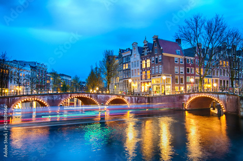 Keizersgracht inersection bridge view of Amsterdam canal and historical houses during twilight time, Netherland.