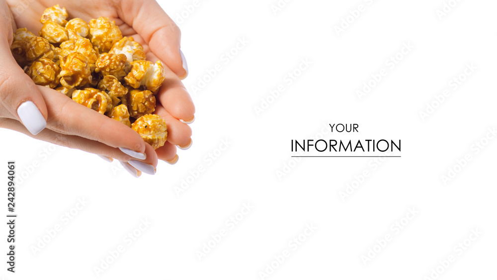 Obraz premium Caramel popcorn in hand pattern on a white background, top view
